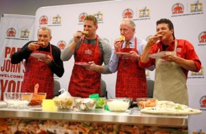 The Papa John's team celebrates the launch of its Quality Guarantee at Super Bowl 50. (Graphic courtesy of Business Wire)