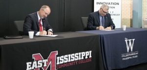 EMCC President Dr. Thomas Huebner, left, and MUW President Dr. Jim Borsig formally sign a new articulation agreement to benefit Manufacturing Technology & Engineering graduates from EMCC. (Photo courtesy of MUW University Relations)