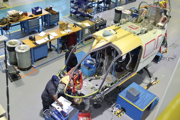 Airbus employees complete wiring on the Lakota UH-72A helicopter for the U.S. Army in Columbus on Tuesday morning - Mary Pollitz, Dispatch Staff
