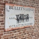 Bulley's Loodge - Craft Butcher sign showing cows and "est. 2023"